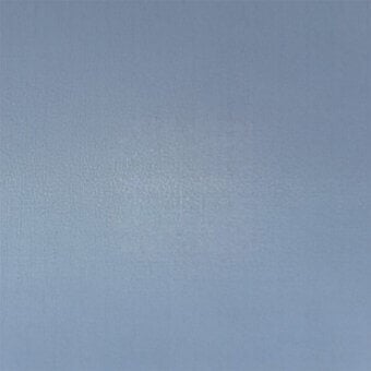 Pale blue-gray plaster wall texture with gradient shading, granular surface, and uneven finish; neutral backdrop composition.